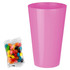 A pink party cup next to a clear bag of colourful jelly beans in assorted flavours.