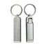 A silver mobile stand and hanger key ring with a textured side and a smooth side, featuring a metal keyring.