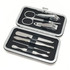 A silver manicure set contains scissors, nail clippers, tweezers, and other grooming tools in a compact case.