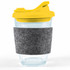 A drinkware item featuring a clear coffee cup with a yellow snap lid and a gray RPET band for grip.