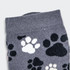 Grey knitted kids' socks featuring a playful pattern of black and white paw prints.