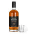 A whisky bottle with a black label and a clear shot glass. The whisky is amber in colour.