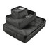 A set of three black packing cubes in various sizes, featuring mesh and zippered compartments.