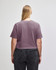 A heavy cotton women's crop boxy t-shirt in a muted mauve colour, featuring a simple design and a logo.