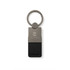 A keytag featuring a metal and black leather design, with a circular keyring and a logo.