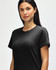 A black Gildan Softstyle ladies midweight T-shirt displayed on a model, featuring a crew neckline and short sleeves.