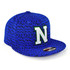 A blue cap with a textured pattern and a prominent letter on the front. It features a branded label.