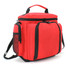 A red cooler bag with black accents, featuring multiple zippers and a detachable shoulder strap. It has a logo on the front.