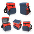A cooler bag in red and navy blue with zippers, a shoulder strap, and mesh pockets. It has a smooth, insulated interior.