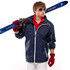 A man in a navy jacket holds skis, wearing red gloves and sunglasses, with a casual outfit underneath.