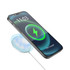 A wireless phone charger in a circular design emits a blue glow, placing emphasis on a phone displaying a charging icon.