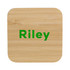A bamboo wireless charger with rounded corners and a green logo, featuring a natural wood finish.