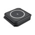 A dark grey wireless charger with a sleek, square design and a circular charging area. It features a logo.