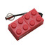 A red building block-shaped flash drive with a keyring attachment and a branding logo.