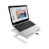 A white foldable laptop stand with a laptop displaying a presentation on it. The stand has an adjustable height design.