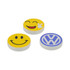 Three round custom moulded wireless chargers in yellow with smiley face designs and a blue Volkswagen logo.
