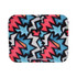 A wireless charger stand featuring a vibrant, abstract pattern with black, pink, blue, and white colours.