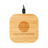 A square bamboo wireless charger with a cable attached and a logo engraved on the surface.