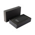 A black wireless power bank with a sleek design, presented in a matching black box with a cushioned interior.