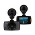 A black dash cam with a front-facing camera and a display, mounted on a suction cup.