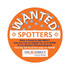 An orange circular promotional sticker with white text and a logo, featuring polka dots and a "Wanted" theme.