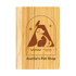 A bamboo notebook featuring a pet-themed design and a logo, showcasing a warm, natural wood color.