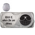A silver sunshade featuring a smiley face and humorous text, folded in a circular shape.