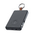 A black magnetic power bank with a keyring attachment, featuring a USB port and charging indicators.
