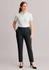 A pair of women's bandless elastic waist pants in dark grey, styled with a white shirt and black heels.