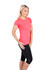 A women's T-shirt in vibrant pink paired with black leggings, featuring a fitted style and short sleeves. It has a logo.