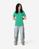 A green heavyweight cotton unisex T-shirt displayed on a model, paired with light blue cargo pants.