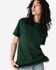 A heavyweight cotton unisex t-shirt in dark green, worn by a model with curly hair. Features a simple, classic design.