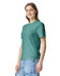 A green heavyweight t-shirt is displayed on a model, featuring a logo on the front and casual styling.