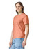 A peach heavyweight T-shirt featuring a round neck and short sleeves, displayed on a model.