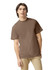 A brown heavyweight adult t-shirt on a model, featuring a casual fit and a plain design.