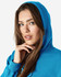A blue Gildan Heavy Blend adult hooded sweatshirt worn by a female model, featuring a hood and drawstring.