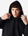 A black Gildan Heavy Blend adult hooded sweatshirt, featuring a drawstring hood and a model adjusting the neckline.