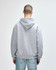 A grey Gildan Heavy Blend adult hooded sweatshirt with a large hood, viewed from the back.
