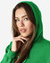 A green hooded sweatshirt featuring a woman with long hair, wearing the hood and posing. The sweatshirt has a logo.