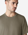 A model wearing a khaki Gildan Ultra Cotton adult t-shirt, featuring a round neckline and short sleeves.