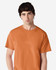 An orange Gildan Ultra Cotton adult t-shirt displayed on a model with short dark hair. The shirt features a logo.