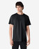 A black Gildan Ultra Cotton adult t-shirt on a model, featuring a simple design and casual fit.