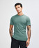 A unisex fine jersey short sleeve t-shirt in teal, featuring a round neckline and casual fit. It has a logo.