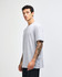 A unisex fine jersey short sleeve T-shirt in grey, featuring a fitted style and a logo on the front.