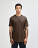 A unisex short sleeve t-shirt in brown, featuring a relaxed fit and a simple design. It has a branding logo.