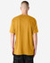 A unisex CVC short sleeve t-shirt in mustard yellow, featuring a plain back and casual fit. It has a small logo.