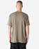 A unisex short sleeve T-shirt in a muted beige colour with a plain back view. The shirt has a branding logo.
