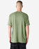 A green unisex CVC short sleeve T-shirt viewed from the back, featuring a plain design and a logo.