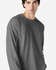 A long sleeve adult t-shirt in grey, featuring a simple design and a logo on the shirt.