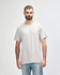 A grey adult t-shirt with a relaxed fit, featuring short sleeves and a crew neckline. It has a logo on it.